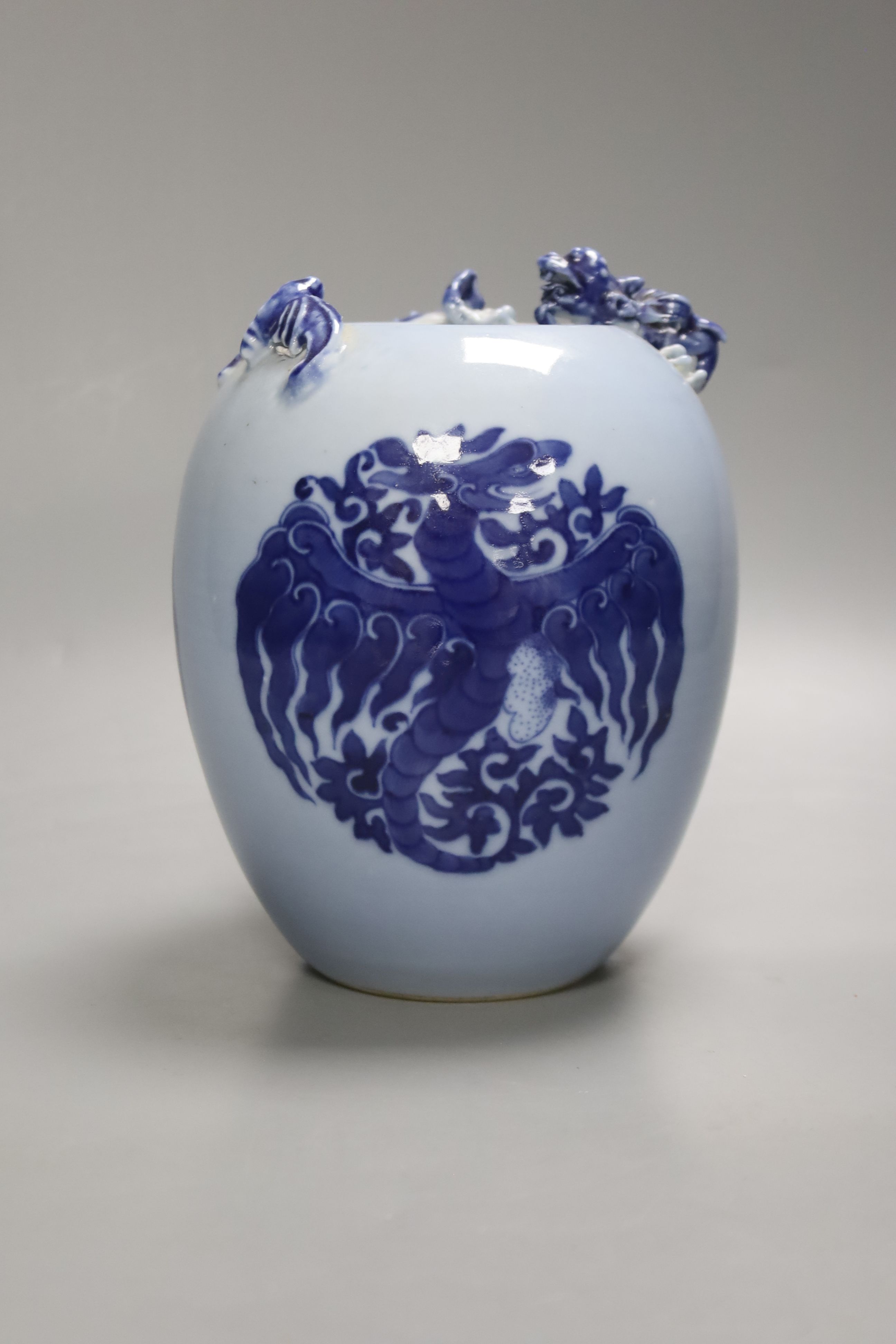 A Chinese blue ground blue and white dragon design vase, 17cm high